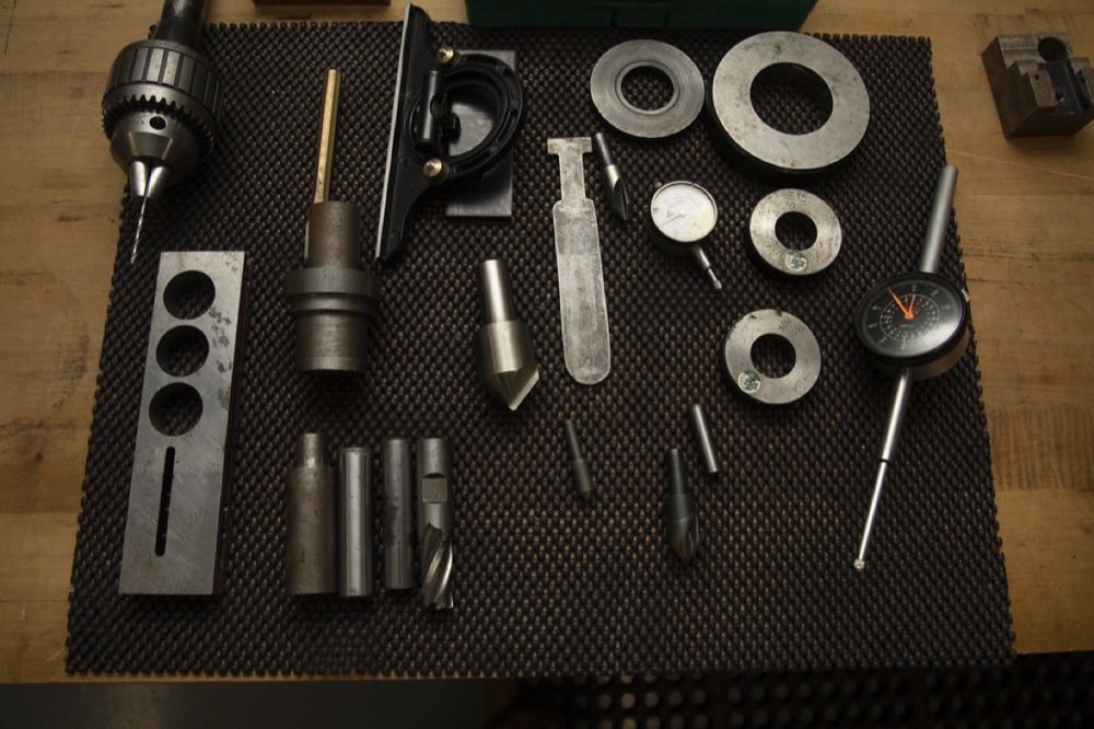 Hand tools laid out on a workbench