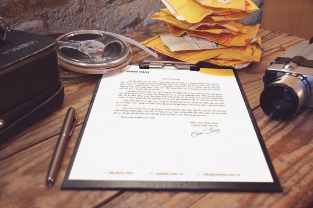 A signed document and pen on a desk